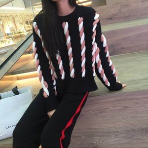 Sweater with braids details